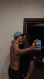 Two guy best friends kissing for the first time.